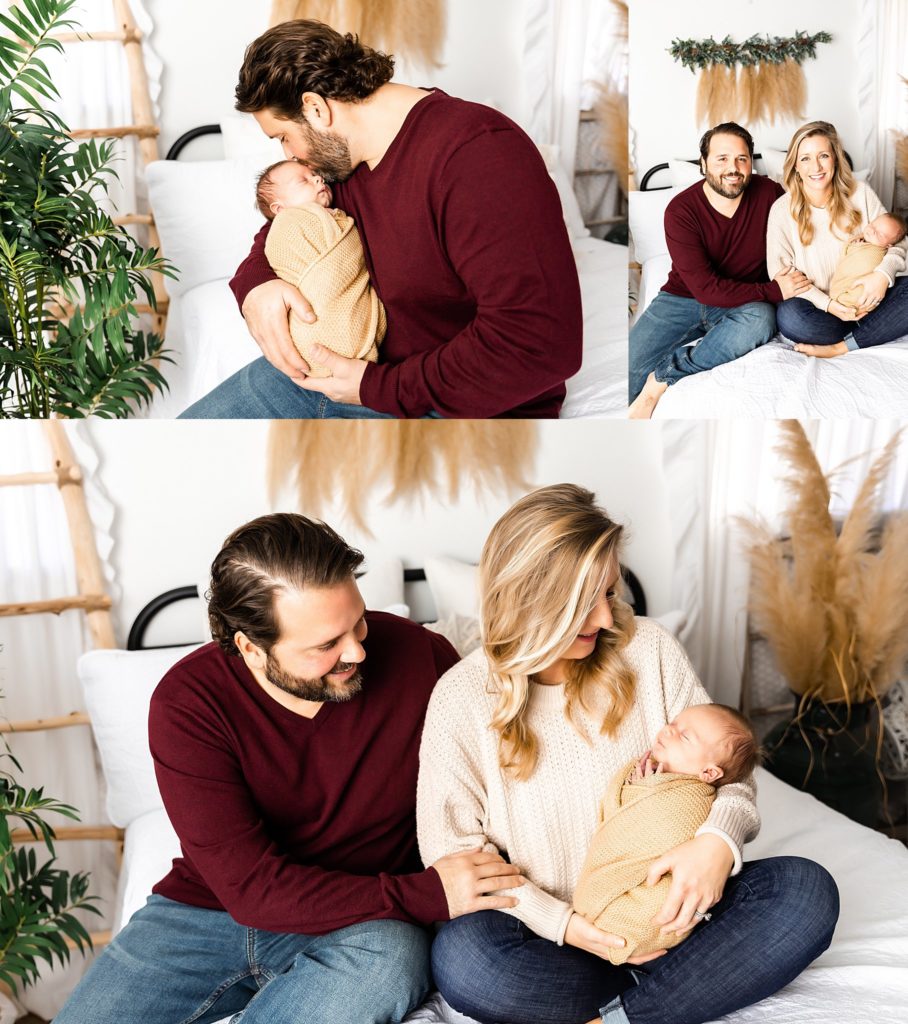 mom-and-dad-holding-newborn-on-bed-in-denham-springs-photography-studio